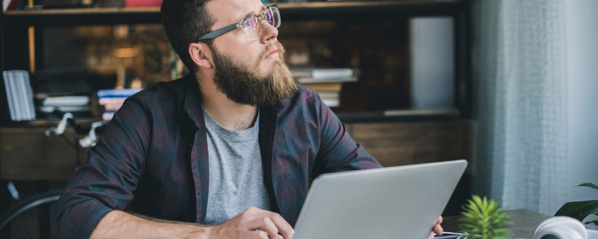 photo of man at computer for story about content distribution